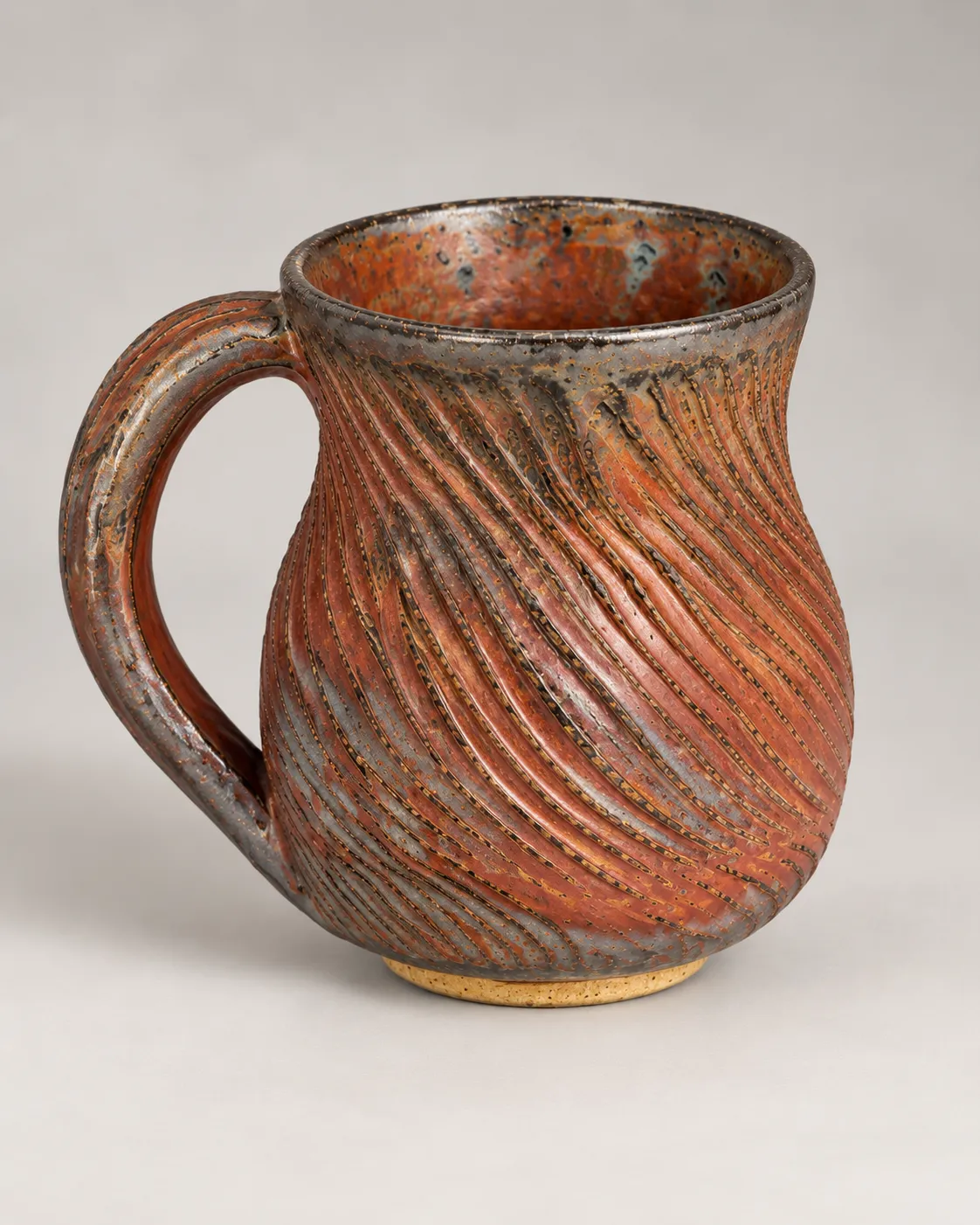 Carved metallic mug, alternate angle