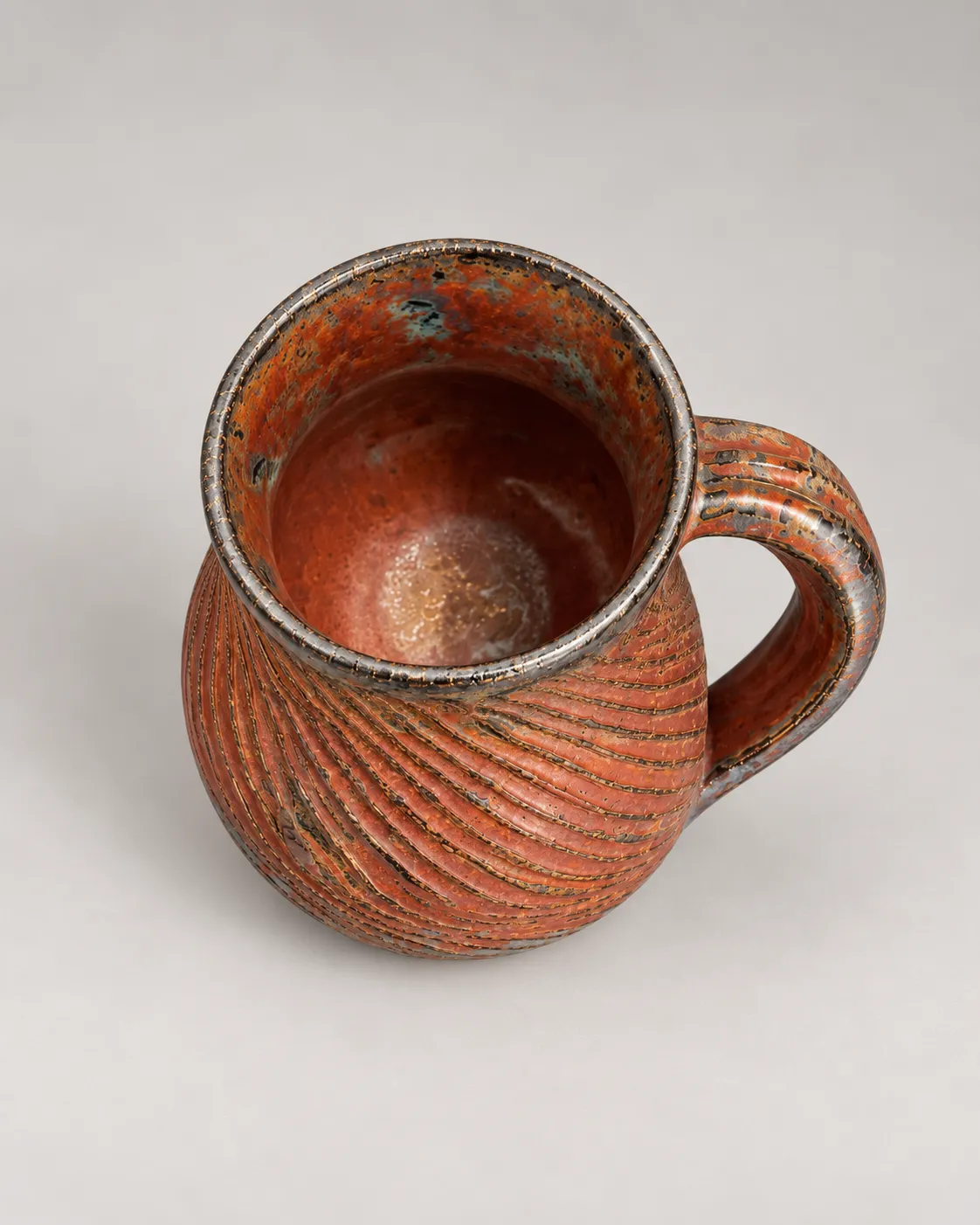 Carved metallic mug, alternate angle